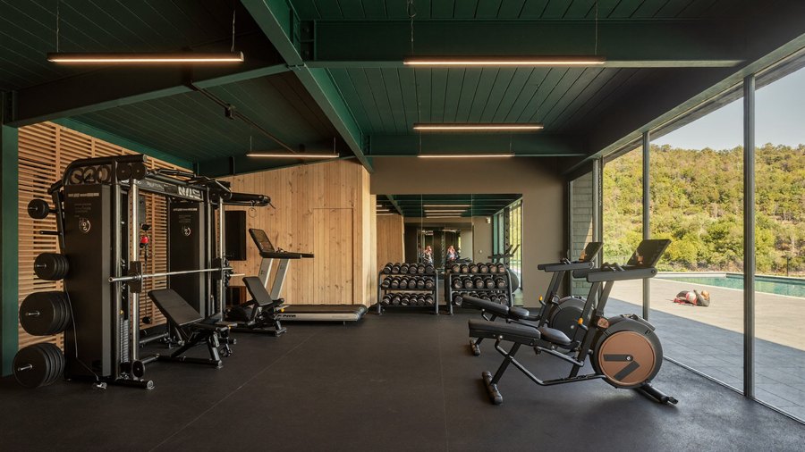 Fitness centre opening onto the pool terrace